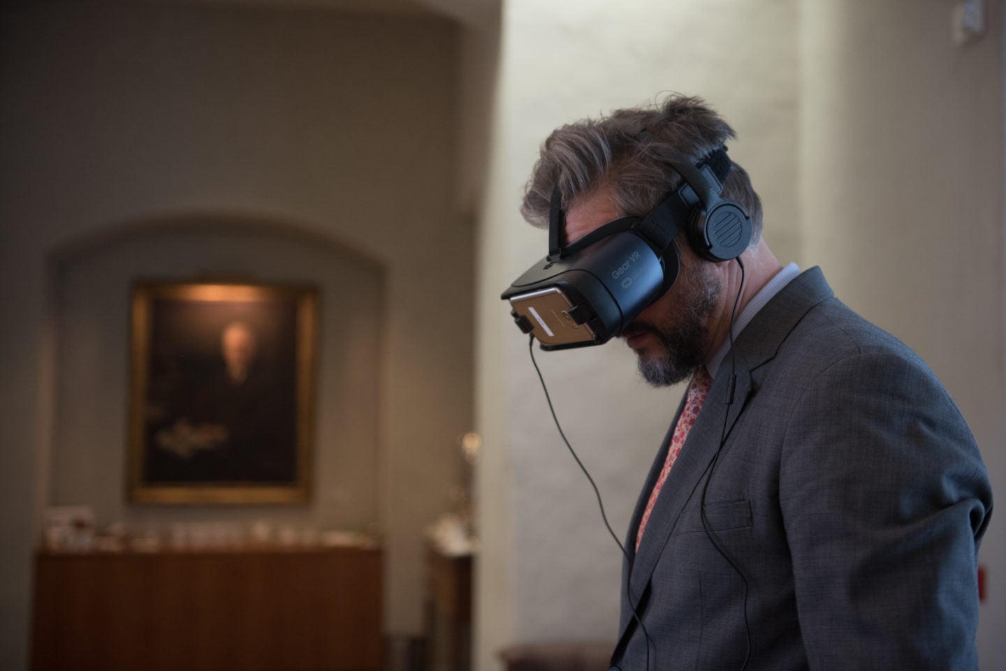 man wearing a suit and wearing virtual goggles