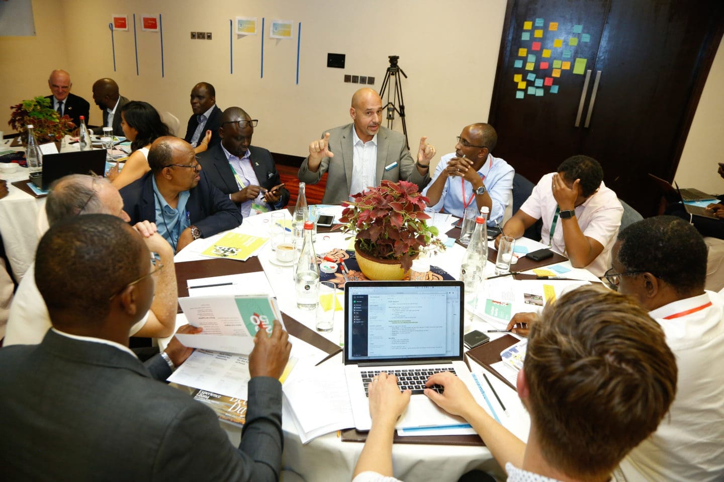 Participants at a luncheon talking around the table.