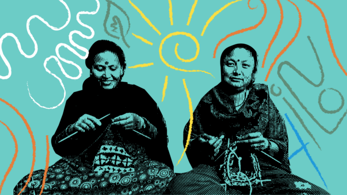 two women sitting with their legs crossed knitting.