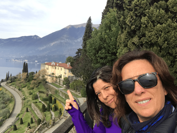 two woman smiling at the camera.