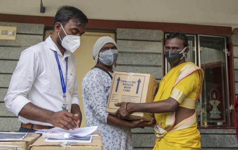 people working at a transgender vaccine drive