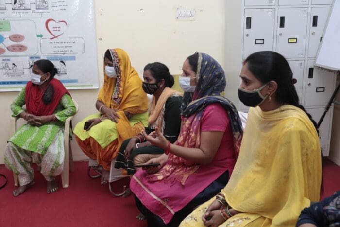 Image is of women gathering at Swasti Health Catalyst community wellness center.