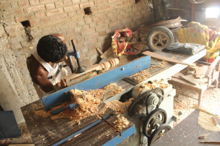 Carpenter in his workshop using electric-powered tools in Bihar in 2015 (Photo Courtesy of SPI)