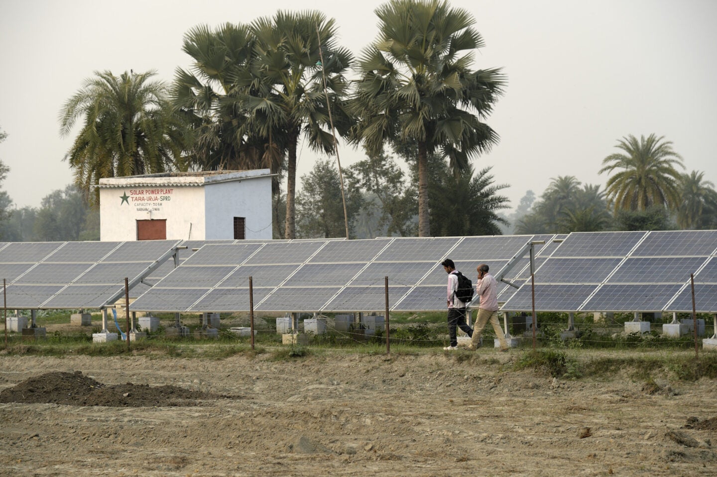 Inspecting solar panels in Nabiganj, Bihar (Photo Courtesy of SPI)