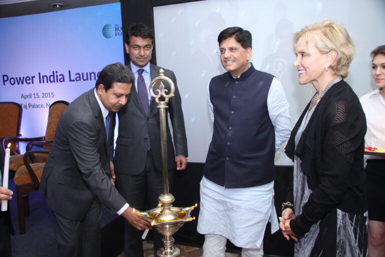 Mukherji lights a ceremonial lamp to mark the launch of SPI on April 15, 2015. Khan and Dr. Rodin also are in attendance along with India's Minister for Power Piyush Goel. (Photo Courtesy of SPI)