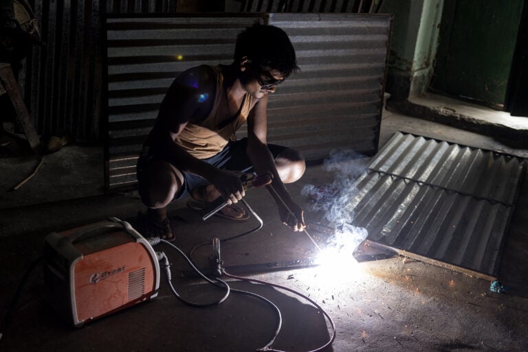 Mini-grids bring electricity to a welder in Jharkhand in 2018 (Photos Courtesy of SPI)