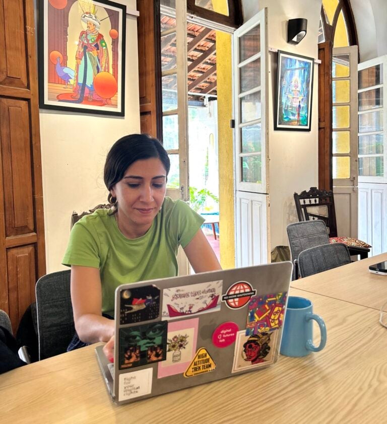 Urvashi Aneja of Digital Futures Lab working at her computer