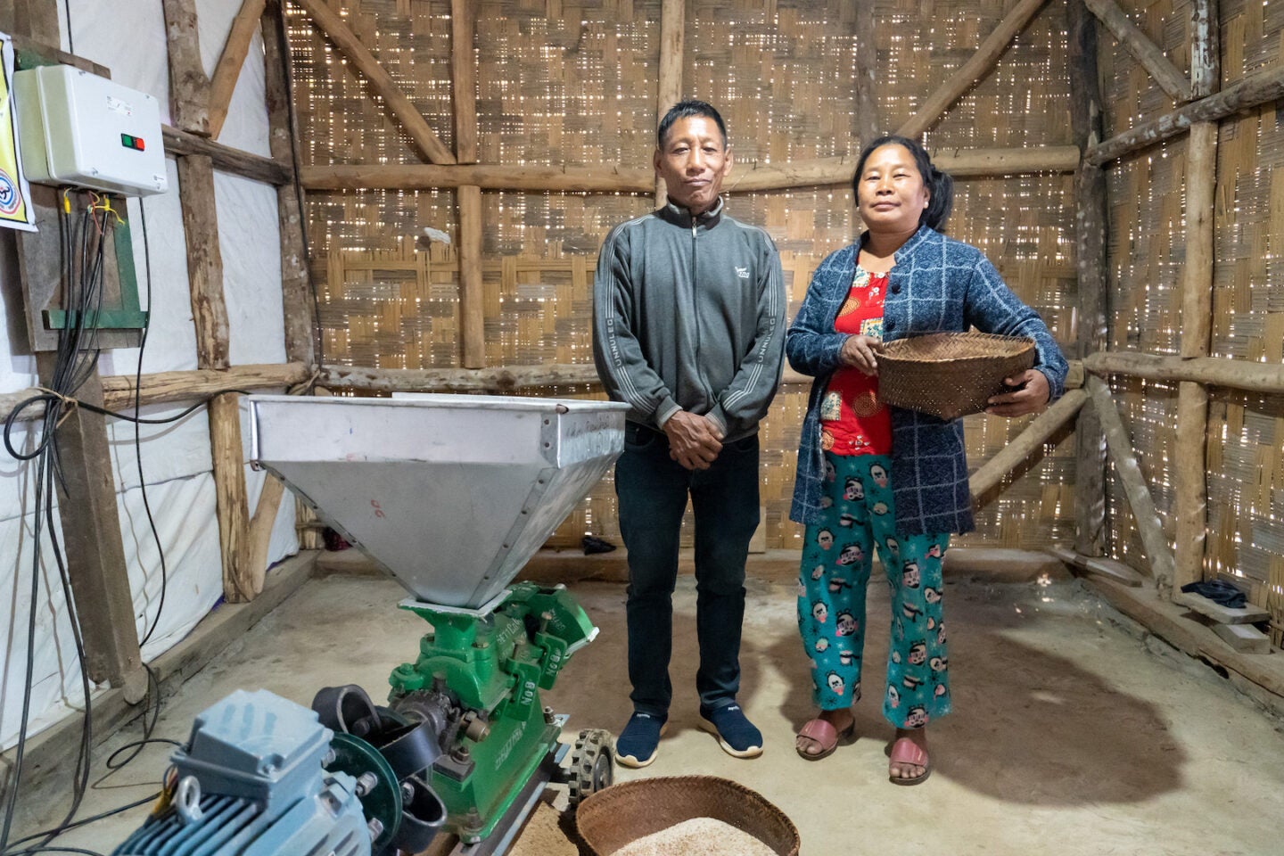 Rice huller and spouse in Nagaland benefitting from solar mini-grids 2022 (Photo Courtesy of SPI)