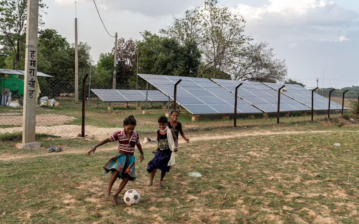Children playing soccer near solar panels in rural Jharkhand State in eastern India, 2018 (Photo Courtesy of SPI)