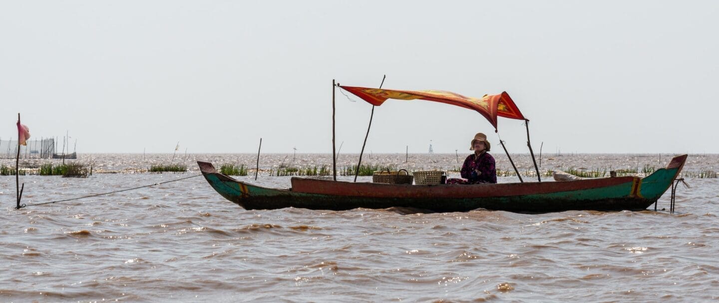 A woman cleans fish she caught on Tonle Sap Lake (Photo Credit Daniel Hansen)