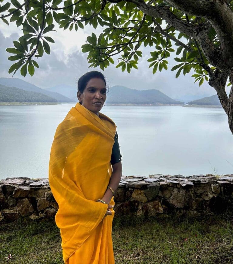 Saraswati Dhruw stands by a Thai reservoir during the inaugural _Building Bridges_ convening (Photo Credit Masha Hamilton)