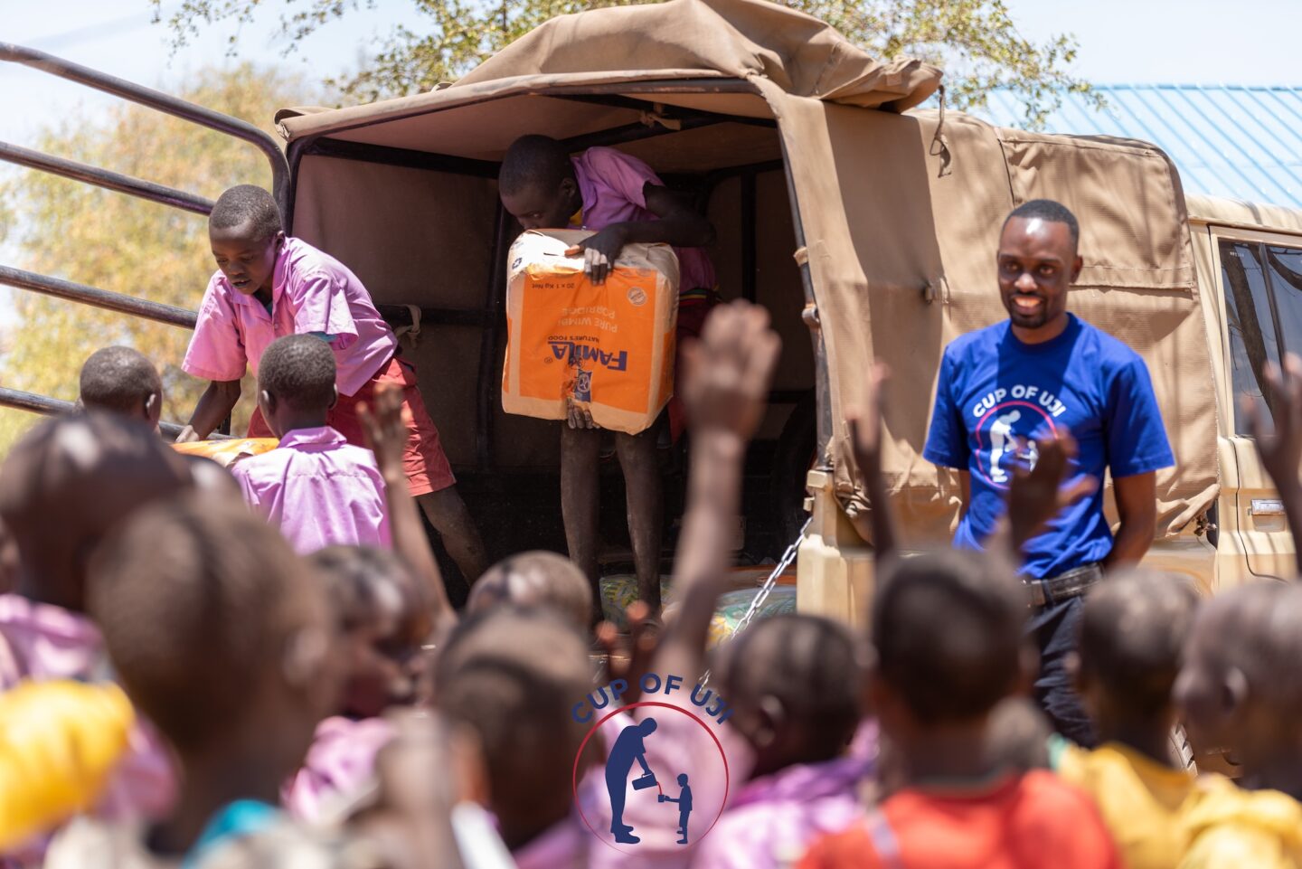 Amonde dropping off uji ingredients at a primary school (Photo Courtesy of Cup of Uji)