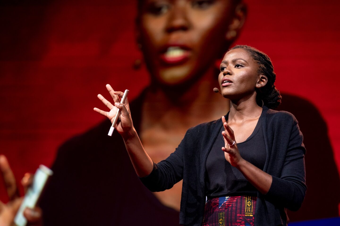 Rose Mutiso speaking at a TED Talk (Photo Courtesy of TED)