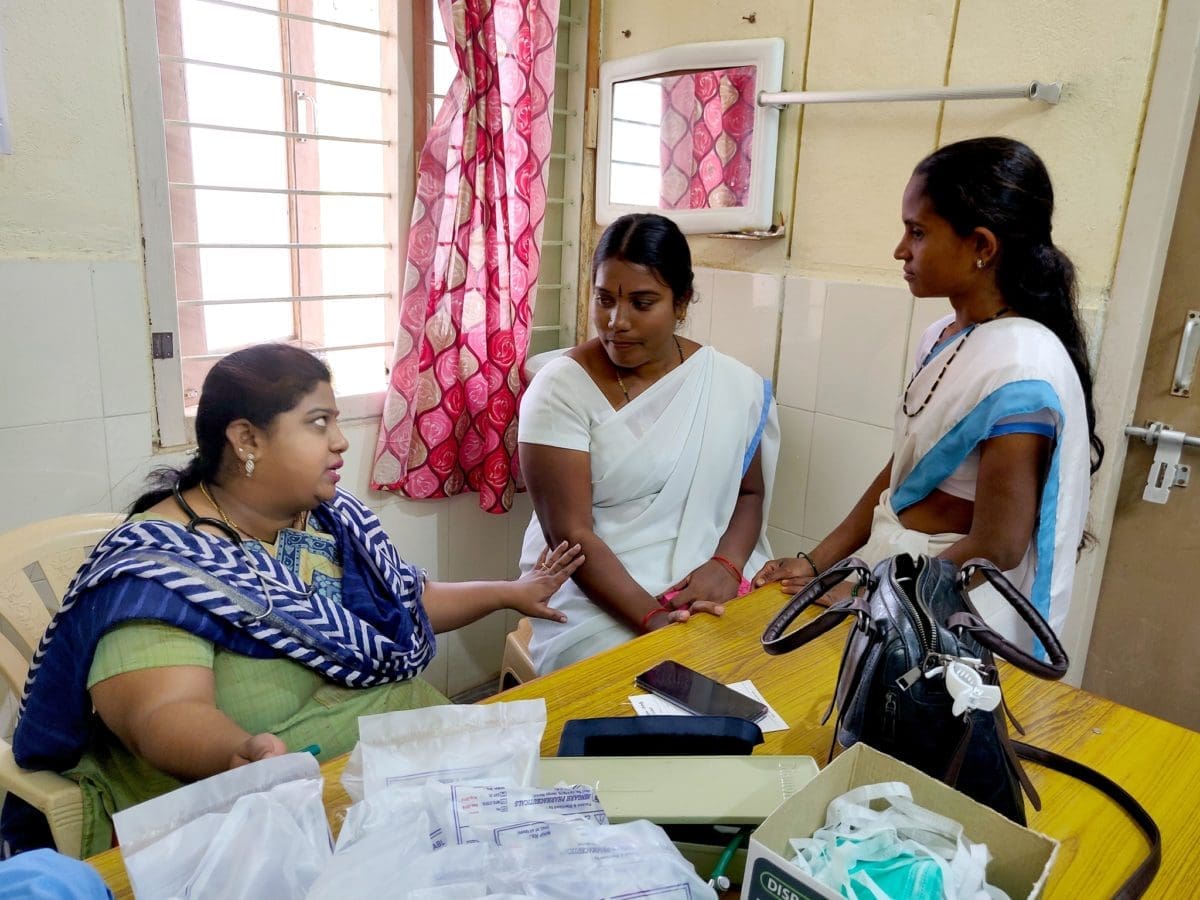 Female members of Project ECHO having a discussion.