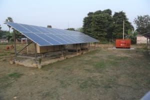 solar panel with trees and the sky in the background.