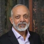 man wearing a suit smiling