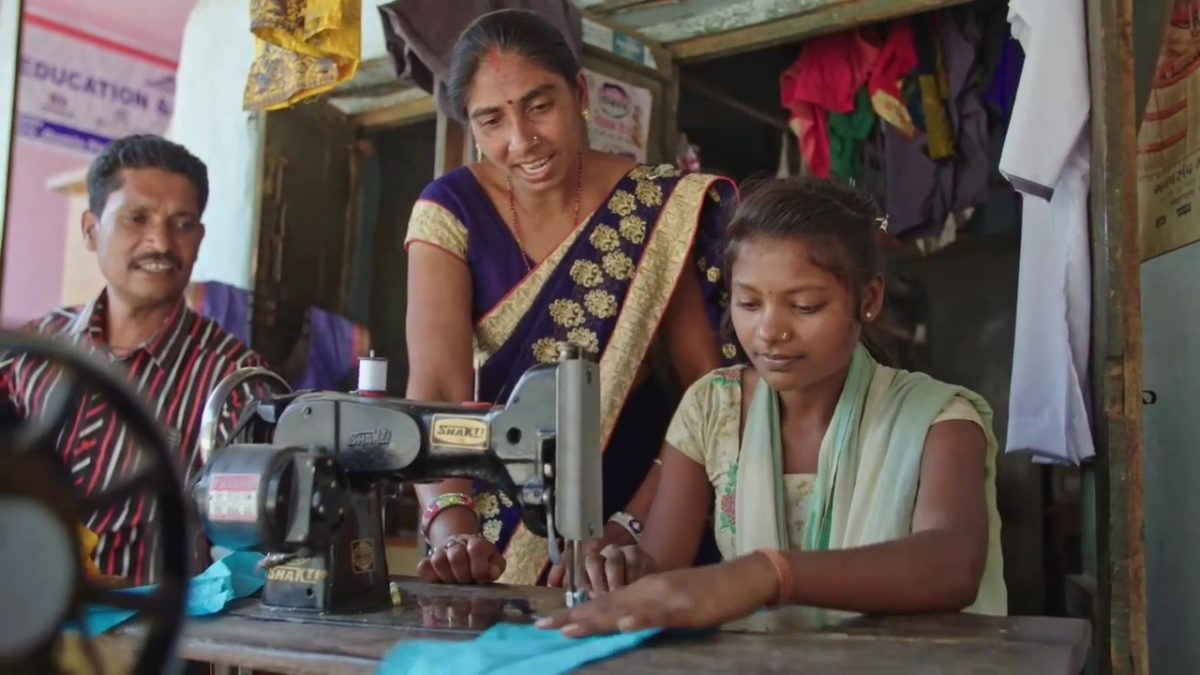 Family sewing in India.